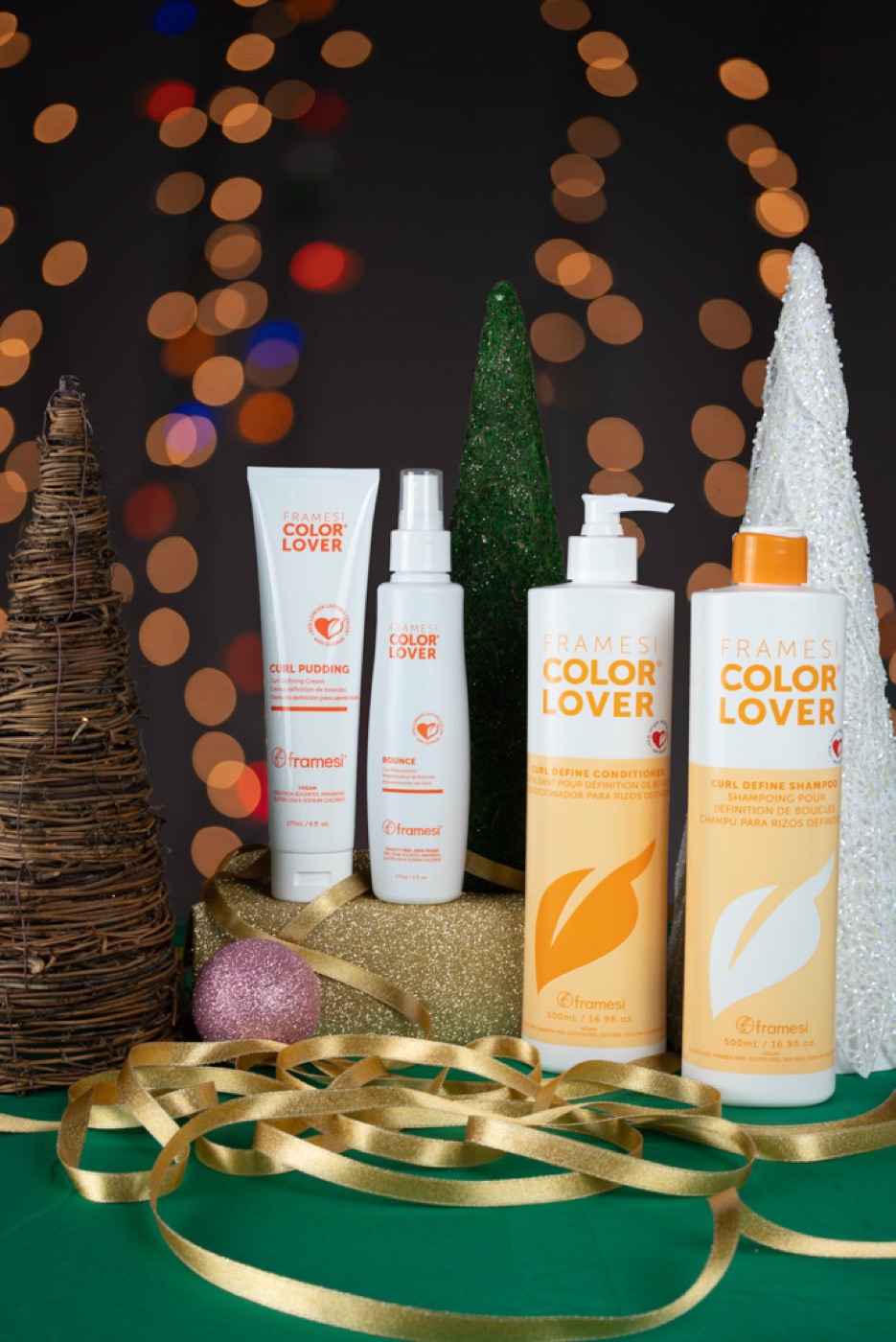 Framesi Color Lover bottles with gold ribbon and bokeh lights