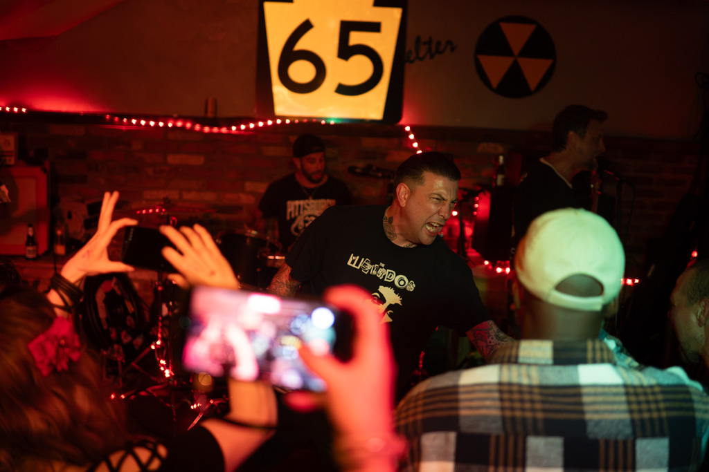 Fans filming the band on their phones