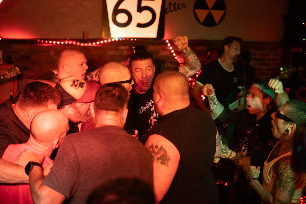 Packed pit with the band behind it